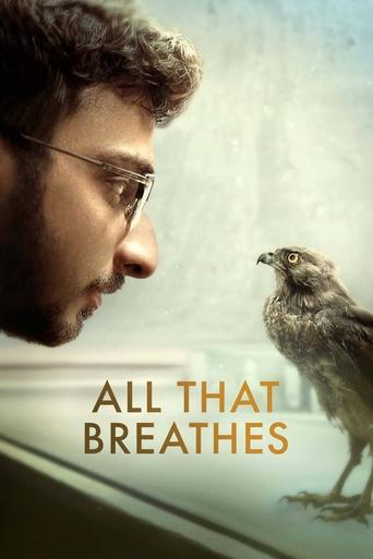 The poster features a contemplative man with glasses gazing at a small bird, evoking a sense of introspection and connection. The muted, earthy tones and soft lighting create a serene atmosphere, suggesting themes of nature, introspection, and perhaps a deeper emotional bond.