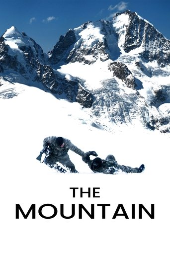 The poster features a lone figure in a snowy mountain landscape, evoking solitude and adventure. The stark white snow contrasts with the rugged, blue-toned peaks, creating a serene yet adventurous mood. The bold text "THE MOUNTAIN" anchors the image, emphasizing the film's title and theme.
