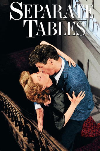 The poster features a romantic couple in a close embrace, with warm tones and soft lighting creating an intimate atmosphere. The title "Separate Tables" is prominently displayed in elegant typography, suggesting themes of romance and separation.