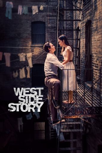 The poster features a dramatic scene with two characters on a fire escape, one in a white dress and the other in a striped shirt, set against a backdrop of brick buildings and hanging laundry. The warm, golden lighting enhances the romantic and intense mood, while the bold text "WEST SIDE STORY" ...
