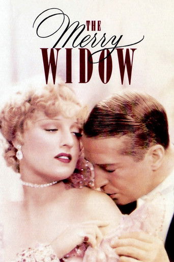 This vintage movie poster for "The Merry Widow" features a glamorous blonde woman in a pink dress embracing a man in a suit. The warm, soft lighting and romantic pose evoke a nostalgic, timeless mood.