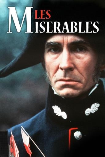 The poster features a stern, weathered man in a dark military uniform with white epaulets, exuding authority and sorrow. The title "Les Misérables" is prominently displayed in bold, red letters against a muted, dark background. The overall mood is somber and dramatic, evoking themes of hardship a...