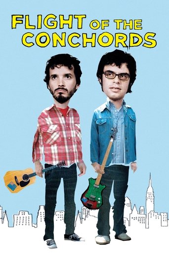 The poster features two musicians with distinctive hairstyles and clothing, one in a red plaid shirt and the other in a denim jacket. They stand against a light blue background with a city skyline silhouette at the bottom. The title "Flight of the Conchords" is prominently displayed in bold yello...
