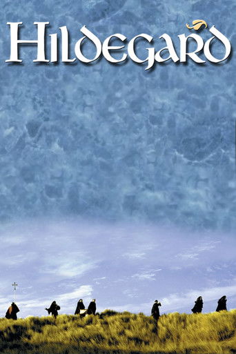 The poster features silhouetted figures standing on a grassy hill under a vast, ethereal blue sky. The title "Hildegard" is elegantly displayed in white serif font at the top. The mood is serene and mysterious, evoking a sense of timeless peace and wonder.