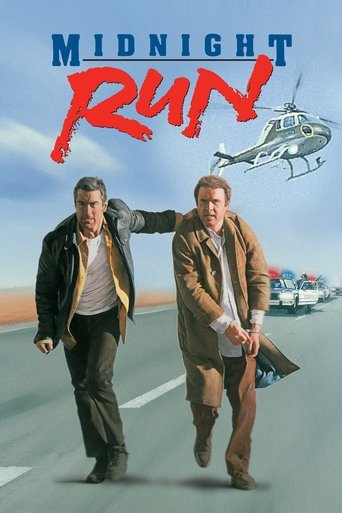 Two men in trench coats run down a highway, with a helicopter flying overhead and a police car in the background. The poster uses warm tones of orange and brown against a blue sky, creating a sense of urgency and action.