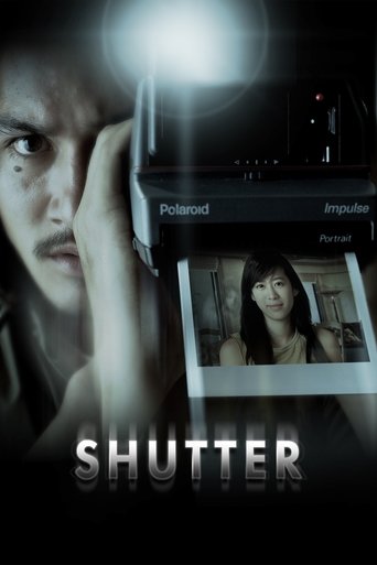 The poster features a close-up of a man with intense, piercing eyes, his hand resting near his face. The background is dark, with a spotlight casting dramatic shadows. A small inset shows a woman looking concerned, while the title "SHUTTER" is prominently displayed in bold, metallic letters. The ...