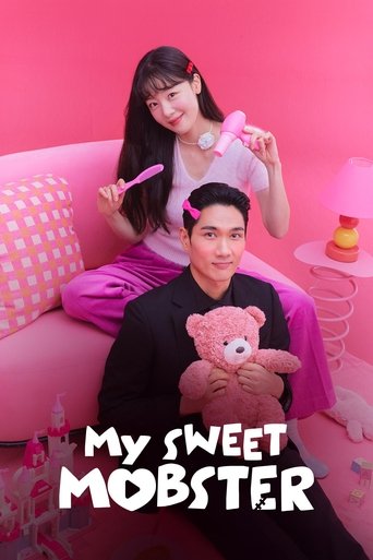 The poster features two individuals in a vibrant pink room, exuding a playful and cheerful mood. The woman in the background holds a pink hairbrush, while the man in the foreground cradles a pink teddy bear. The bold white text "My Sweet Mobster" anchors the image, emphasizing the show's fun and ...