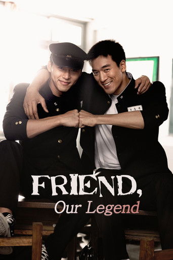 The poster features two men in black suits embracing warmly, their faces lit by soft, golden light. The title "Friend, Our Legend" is prominently displayed in bold, white lettering. The overall mood is nostalgic and cinematic, capturing a moment of camaraderie and shared history.