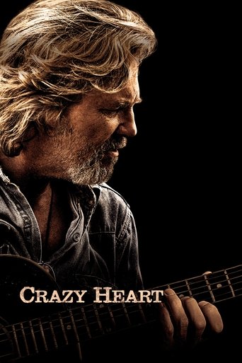 The poster features a close-up of a man with long, wavy blonde hair and a beard, playing an electric guitar against a dark background. The warm, golden lighting highlights his face and the guitar, evoking a mood of introspection and emotional depth. The title "Crazy Heart" is prominently displaye...