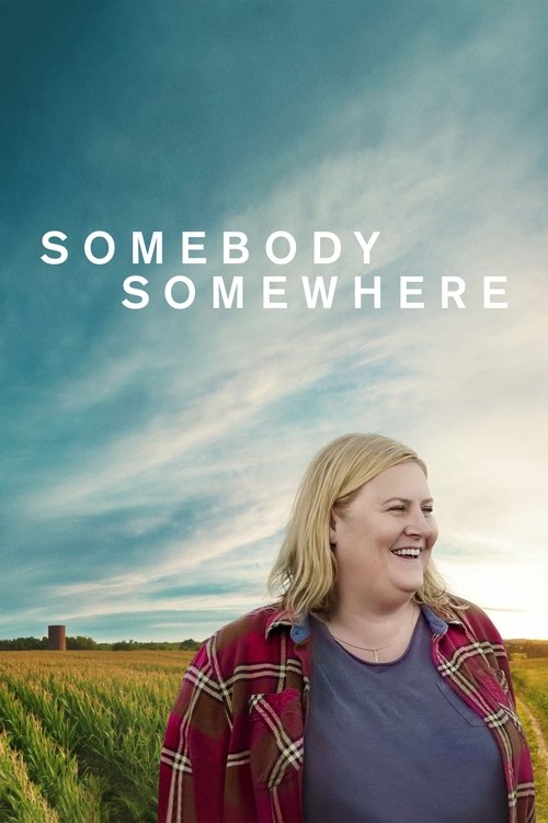 A woman with blonde hair stands in a field, wearing a red plaid shirt over a blue top, smiling against a bright blue sky. The title "SOMEBODY SOMETHWHERE" is prominently displayed in white text.