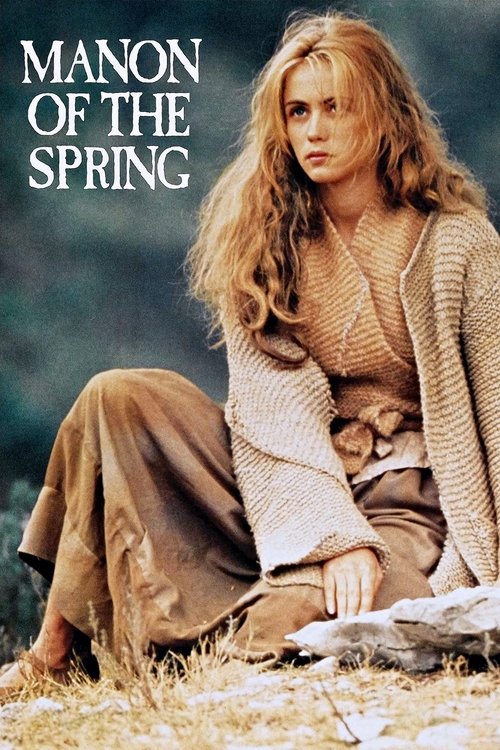 The poster features a woman with long, wavy blonde hair sitting on a bed of golden grass. She wears a textured beige sweater and brown pants, exuding a serene, contemplative mood. The title "MANON OF THE SPRING" is prominently displayed in bold, white letters at the top.