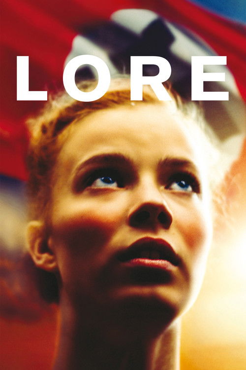 The poster features a close-up of a woman with intense, hopeful eyes, her face illuminated by warm sunlight against a blurred background of red and blue hues. The bold, white text "LORE" dominates the top, suggesting a dramatic and emotional narrative.