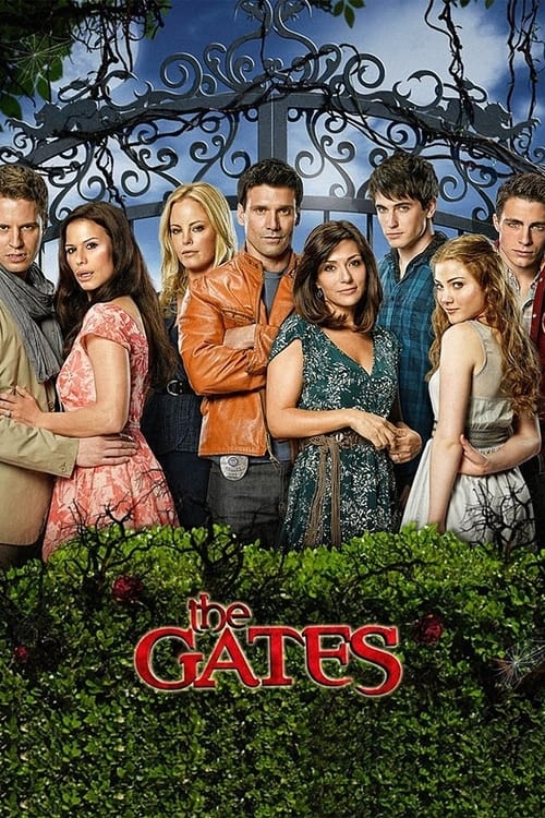 This TV show poster features a group of eight characters standing in front of a grand, wrought-iron gate under a blue sky. The characters are dressed in colorful, casual clothing, creating a lively and inviting atmosphere. The red title "The Gates" stands out prominently against the green foliage...