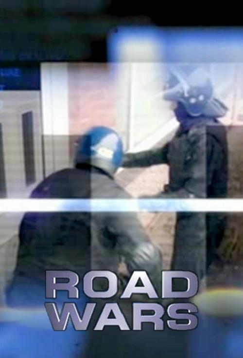 The poster features two figures in tactical gear, one with a blue helmet and the other in dark clothing, suggesting a military or combat theme. The muted blue and gray tones evoke a gritty, serious atmosphere, while the bold white text "ROAD WARS" anchors the image with a commanding, documentary-...