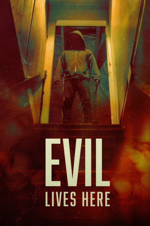 The poster depicts a mysterious figure in a hooded cloak walking down a dimly lit hallway, evoking a sense of dread and mystery. The warm yellow and orange hues create an eerie atmosphere, while the bold, white text "EVIL LIVES HERE" reinforces the ominous theme.