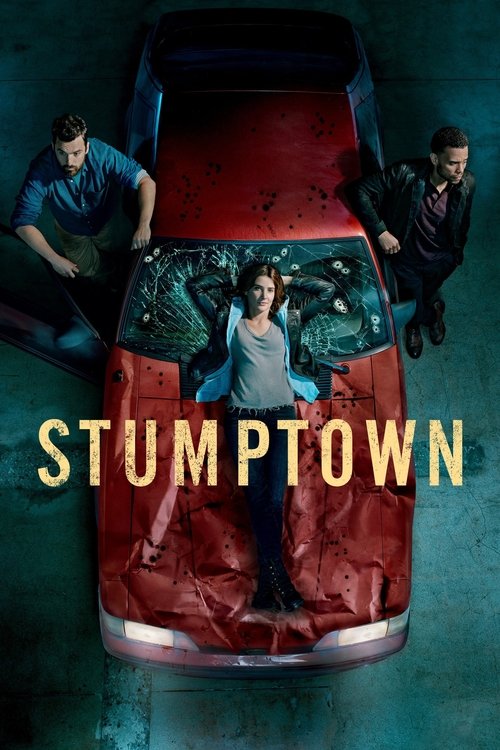 The poster features a red pickup truck with a young man standing on its hood, surrounded by two men leaning on the sides. The scene is set in a dimly lit environment with a moody, atmospheric tone. The title "STUMPTOWN" is prominently displayed in bold, golden letters across the lower part of the...