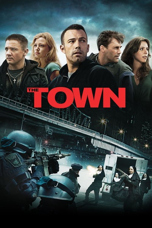 The poster features a group of characters against a dramatic, stormy sky. In the foreground, armed soldiers in tactical gear stand ready for action. The title "THE TOWN" is prominently displayed in bold red letters. The overall mood is tense and action-packed, suggesting a high-stakes thriller.