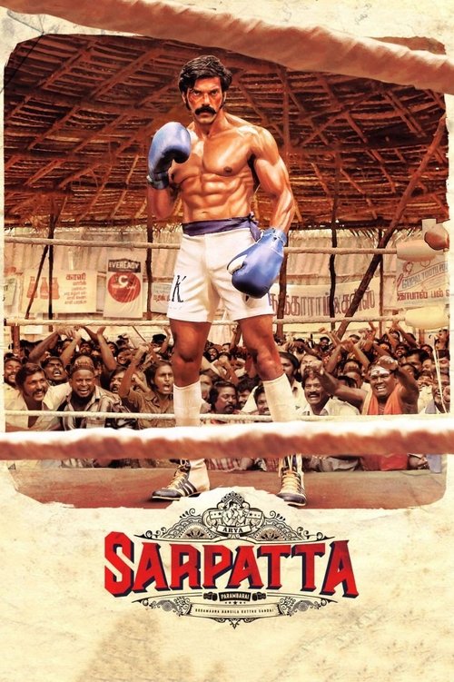 The poster features a muscular boxer in a white gi with blue gloves, standing confidently in a boxing ring. The background shows a crowd of spectators, and the title "Sarpatta Parambarai" is prominently displayed at the bottom. The overall mood is intense and dramatic, capturing the spirit of box...