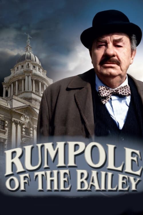 The poster features a stern, weathered man in a bow tie and hat against a backdrop of a grand, classical building under a moody sky. The title "Rumpole of the Bailey" is prominently displayed in bold, metallic lettering. The overall mood is serious and dramatic, evoking themes of authority and hi...