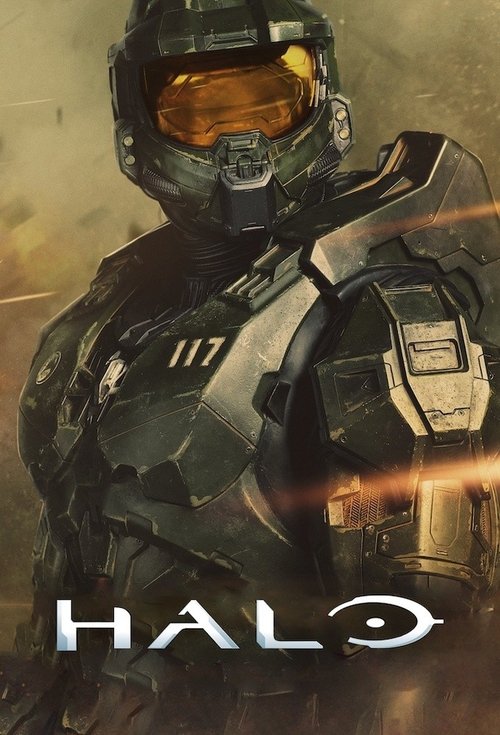 The poster features a futuristic soldier in a detailed, metallic armor suit with a reflective visor, set against a gritty, dusty background. The color palette is dominated by dark greys and muted earth tones, creating a somber yet intense atmosphere. The bold, metallic "HALO" text at the bottom r...