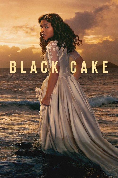 The poster features a young woman in a flowing white dress standing at the water's edge, her dark hair blowing in the wind. The warm sunset hues blend with the ocean, creating a dreamy, nostalgic atmosphere. The title "BLACK CAKE" is prominently displayed in bold, golden letters, evoking a sense ...