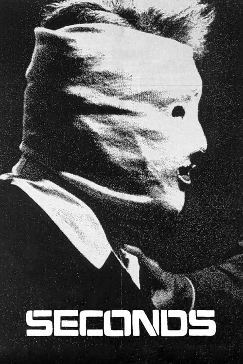 The poster features a man in a white mask, his face partially obscured, with a serious expression. The black and white color scheme creates a stark, dramatic mood. The title "SECONDS" is prominently displayed at the bottom in bold, white letters.