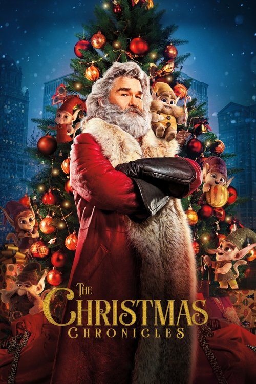 A festive Christmas movie poster featuring a man in a red coat holding a child, surrounded by twinkling lights and ornaments. The warm reds and golds create a cozy holiday atmosphere, while the title "The Christmas Chronicles" is elegantly displayed at the bottom.
