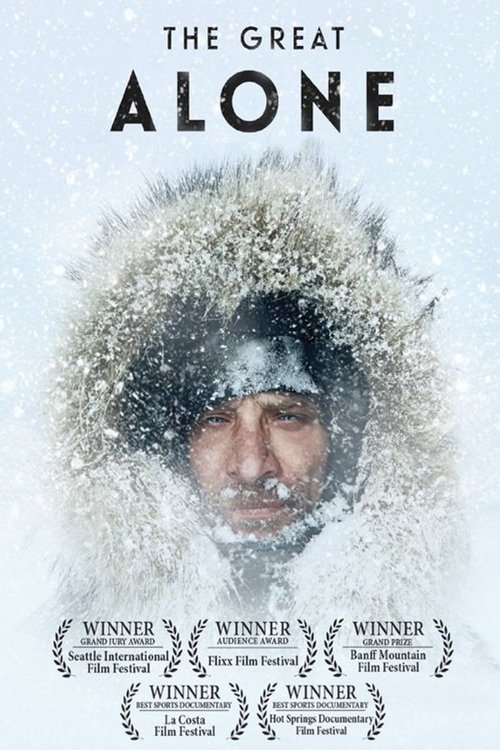 The poster features a man in a heavy, snow-covered fur hat, evoking isolation and cold. The muted blue and white tones suggest a wintry, desolate atmosphere. The title "The Great Alone" dominates the top, hinting at themes of solitude and wilderness.
