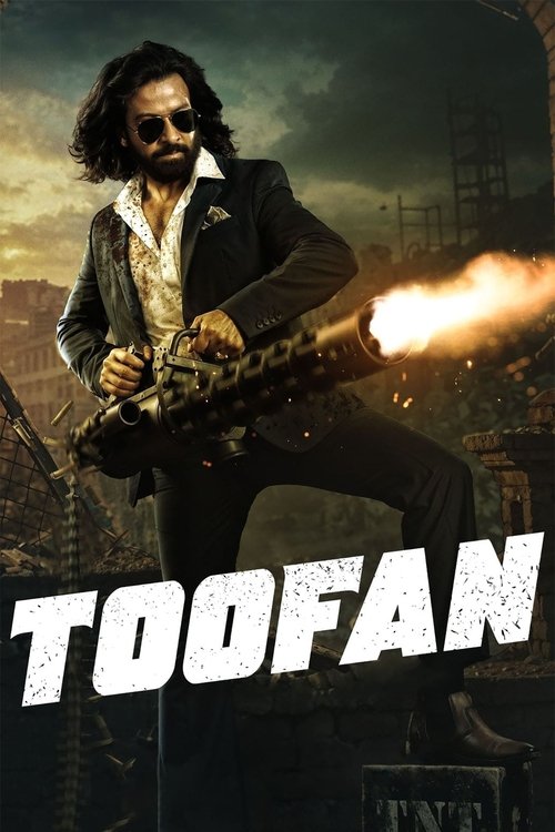 The poster features a rugged man with long hair and sunglasses, holding a large gun with a flamethrower effect. The background shows a gritty, war-torn cityscape with smoke and debris. The bold, distressed white text "TOOFAN" dominates the bottom, conveying a sense of intensity and action.