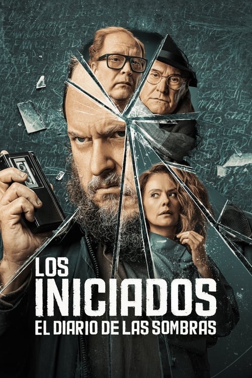 The poster features a man with a beard and glasses holding a camera, surrounded by fragmented glass that creates a shattered effect. Behind him, two other characters look concerned, while a woman in the foreground gazes forward. The dark, moody atmosphere combined with the fragmented imagery evok...