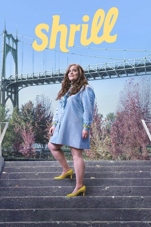 A woman in a blue dress stands confidently on stone steps under a bridge, her vibrant yellow shoes contrasting with the muted tones of the surroundings. The title "Shrill" appears in playful yellow letters against the sky, suggesting a lively, upbeat tone.