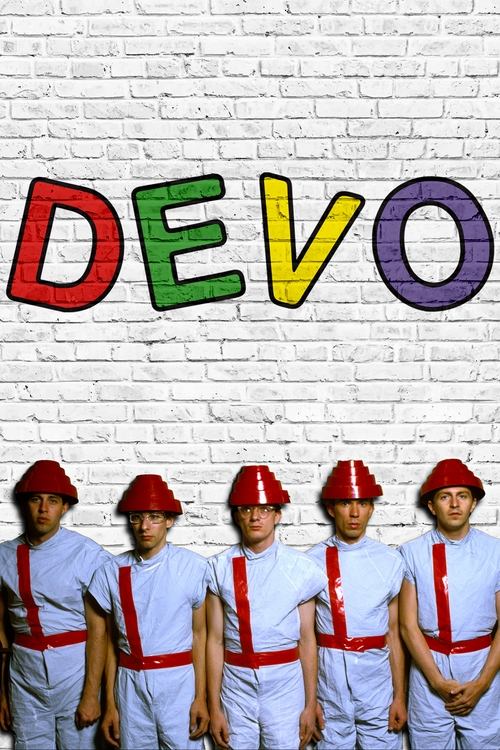 A group of six young men in matching white uniforms and red hard hats stand proudly against a white brick wall, with the colorful letters "DEVO" prominently displayed above them. The vibrant colors and confident poses convey a sense of unity and youthful energy.