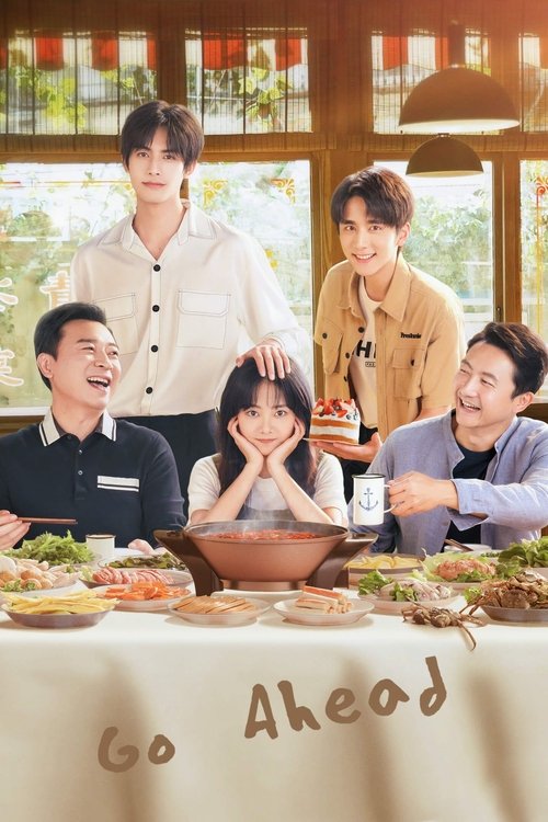 This TV show poster features a warm, inviting scene with five people gathered around a table laden with food. The group exudes a friendly and relaxed mood, with one person smiling broadly and others engaged in conversation. The soft lighting and natural colors create a cozy atmosphere, suggesting...