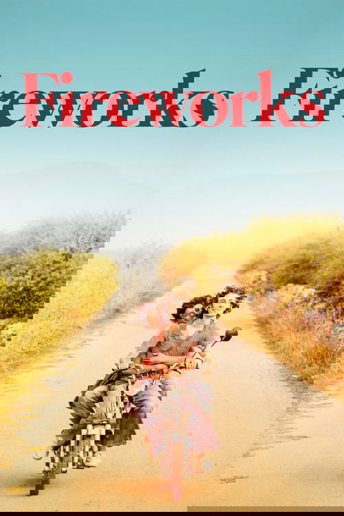 A couple rides a bicycle down a sun-drenched road, surrounded by golden fields and vibrant greenery. The poster features bold red text against a clear blue sky, evoking a sense of joy and freedom.