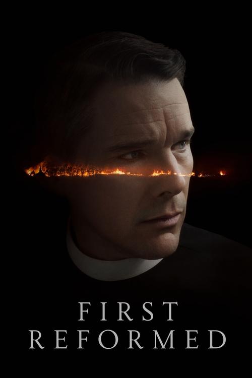 The poster features a man in a dark suit against a black background, with a fiery orange line cutting through his face, suggesting intense emotion or conflict. The title "First Reformed" is prominently displayed at the bottom in white text, conveying a serious and dramatic tone.