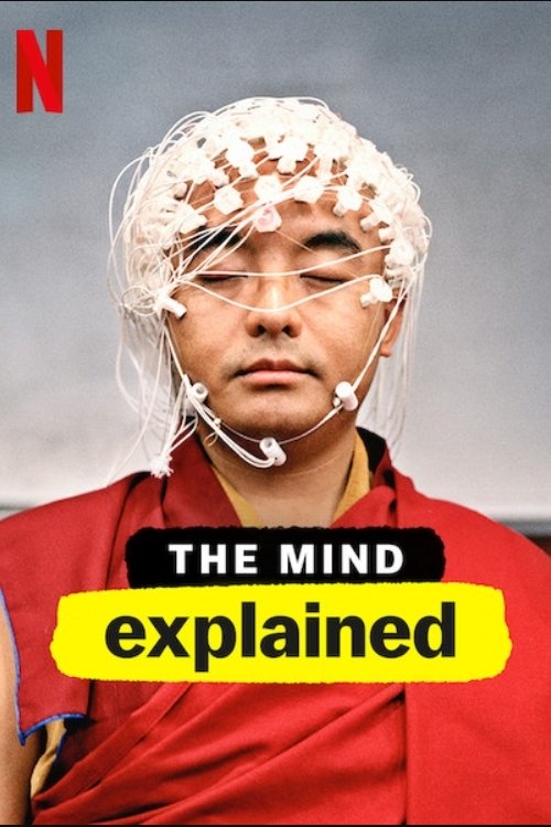 The poster features a man with a white headband and glasses, wearing a red shirt. The title "The Mind Explained" is prominently displayed in bold text. The overall mood is serious and informative.