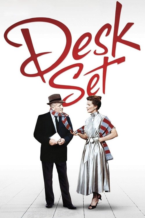 The poster features a man in a black suit and hat, and a woman in a stylish silver dress, standing against a white background. The title "Desk Set" is written in bold red letters at the top. The mood is playful and whimsical, suggesting a comedy or light-hearted narrative.