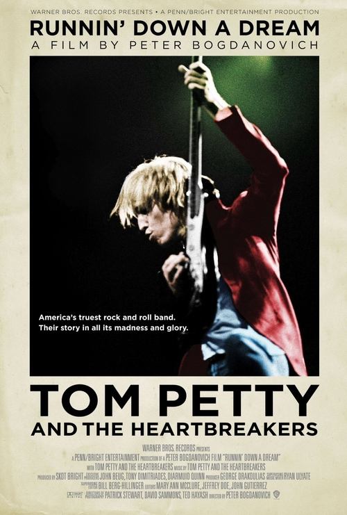 The poster features a striking image of Tom Petty passionately playing an electric guitar, with a dramatic spotlight illuminating his intense expression. The bold red and black color scheme exudes energy and passion, while the tagline hints at a powerful musical journey. The overall composition c...