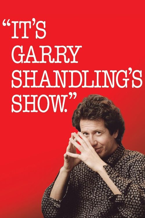 The poster features a woman with short curly hair against a vibrant red background, her hand raised near her face in a thoughtful pose. The bold white text reads "IT'S GARRY SHANDLING'S SHOW" in quotation marks, emphasizing the show's title. The overall composition conveys a sense of intellectual...