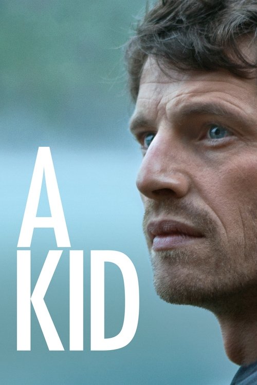 The poster features a close-up of a man with a somber expression, his face partially shadowed against a soft, muted background. The bold, white text "A KID" dominates the left side, creating a stark contrast that hints at the film's themes of identity and struggle. The overall mood is serious and...