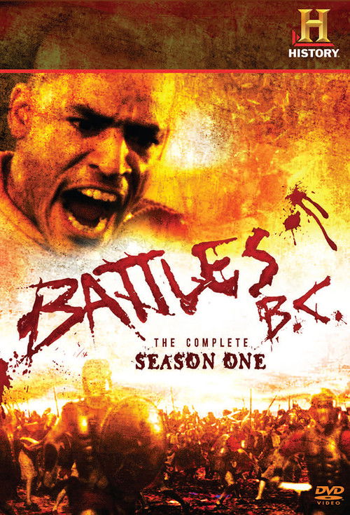 The poster features a gritty, fiery battle scene with a soldier screaming in the foreground, surrounded by a chaotic crowd. Dominating the upper half is a dramatic, intense expression of conflict, while the bottom half shows a fiery, action-packed backdrop. The colors are warm and intense, with o...