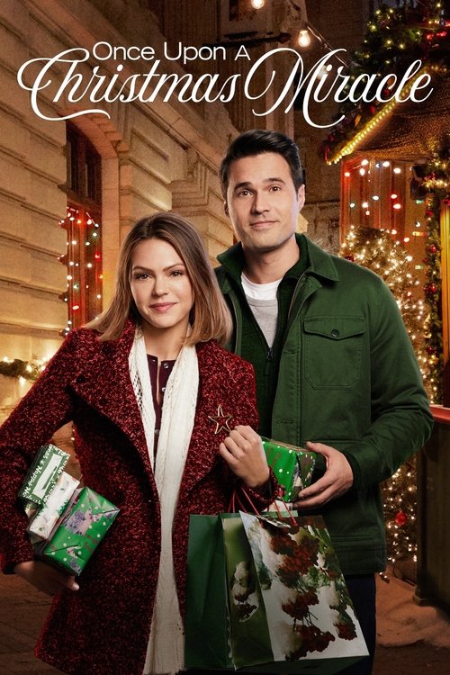 The poster features a couple standing in front of a beautifully decorated Christmas tree, exuding warmth and joy. The woman wears a festive red coat, while the man sports a green jacket. Their expressions convey happiness and anticipation for the holiday season. The overall composition evokes a c...