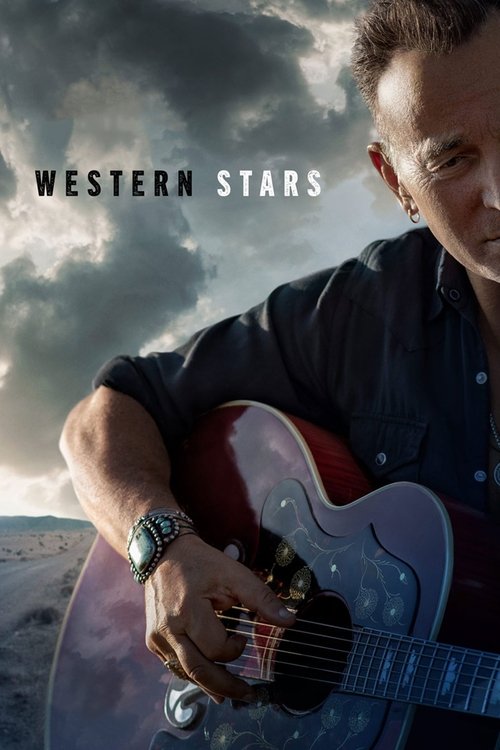 A man in a dark shirt plays an electric guitar against a dramatic, stormy sky. The poster conveys a rugged, adventurous mood with earthy tones and a sense of freedom.