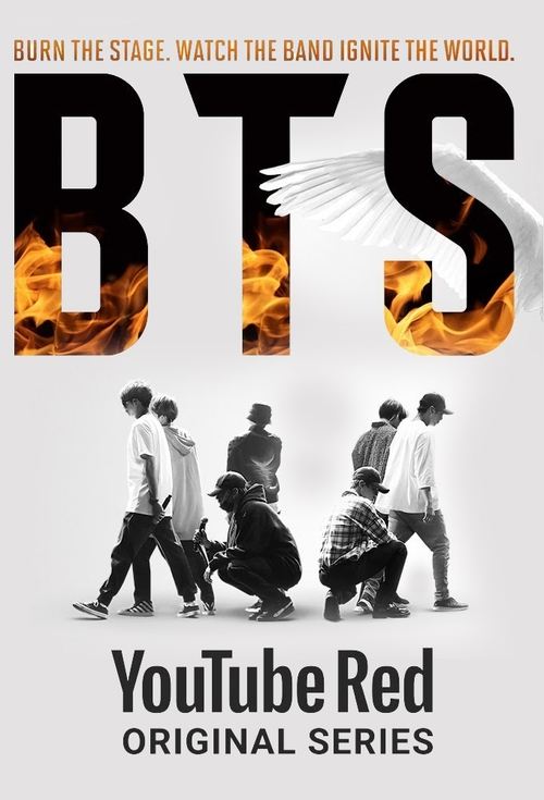 The poster features silhouettes of BTS members against a fiery background, symbolizing their intense stage presence. The bold "BTS" text with flames emphasizes their musical energy. The YouTube Red branding indicates this is a popular original series.