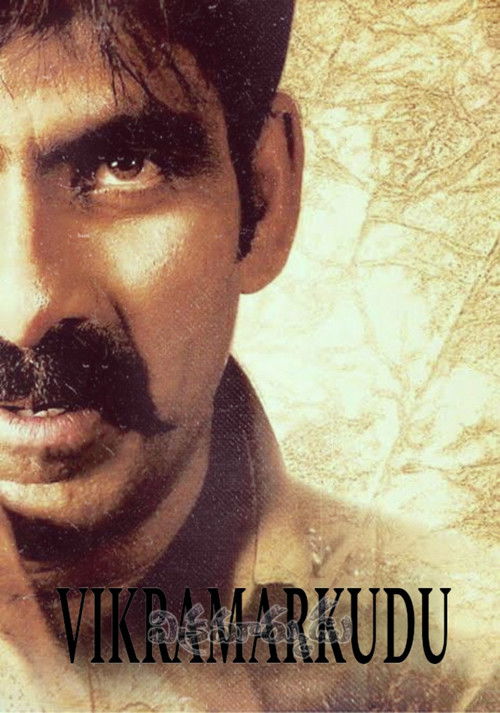 The poster features a close-up of a man with a distinctive mustache, his eyes gazing upward with an intense expression. The warm, sepia-toned background adds a vintage feel, while the bold, stylized text "Vikramarkudu" at the bottom hints at the film's title. The overall mood is dramatic and evoc...