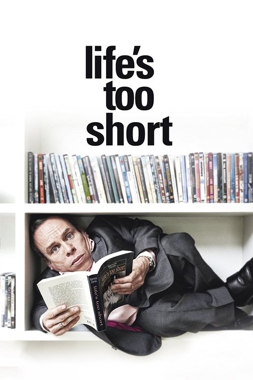 The poster features a man in a black suit lying on a white shelf, reading a book while surrounded by colorful magazines. The bold text "Life's Too Short" dominates the top, conveying a humorous and slightly melancholic tone about the fleeting nature of life.