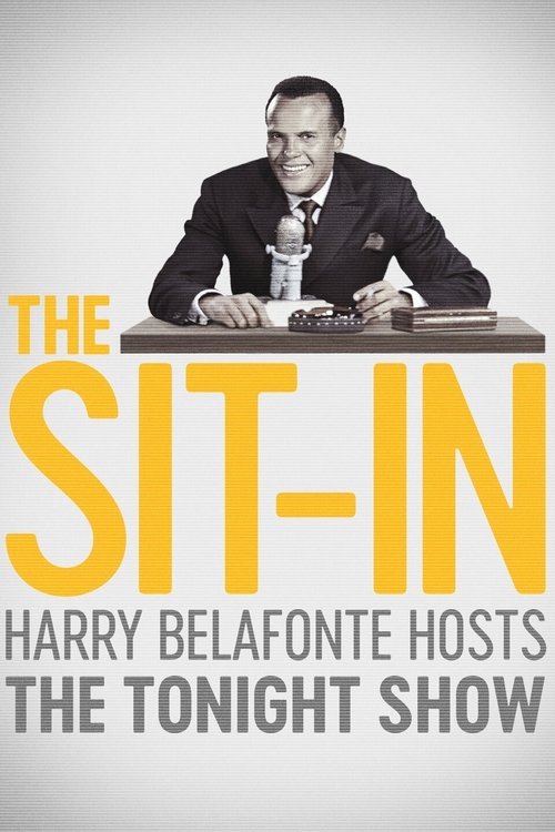 The poster features a man in a suit sitting at a desk, holding a microphone, with the title "The Sit-In" prominently displayed in bold yellow letters. The background is a soft gray, and the overall mood is professional yet relaxed, suggesting a late-night talk show.