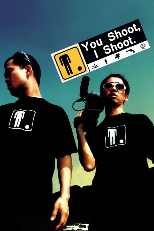 The poster features two men in black shirts with a logo, set against a vibrant blue sky. One man holds a camera, while the other stands with his hand on his hip. The mood is intense and dramatic, suggesting a thriller or action movie. The bold text "You Shoot, I Shoot" emphasizes the action-packe...