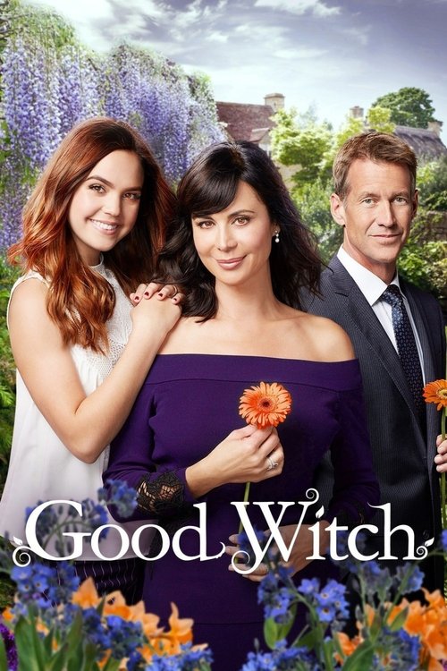 The poster features three women standing in a garden with purple lavender flowers in the background. The central woman holds a bright orange flower, while the others wear elegant dresses. The mood is cheerful and inviting, with warm lighting and a sense of celebration. The title "Good Witch" is p...