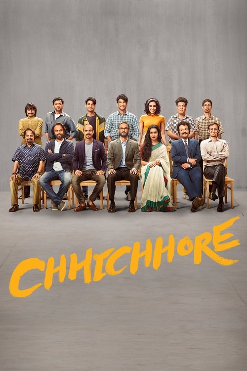 A group of diverse characters sits together on wooden chairs against a gray backdrop, exuding a warm, nostalgic atmosphere. The vibrant colors of their clothing contrast with the muted background, creating a visually striking composition. The title "CHHICHHORE" in bold yellow letters anchors the ...